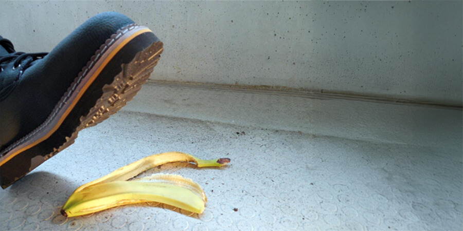 A boot about to step on a banana skin.