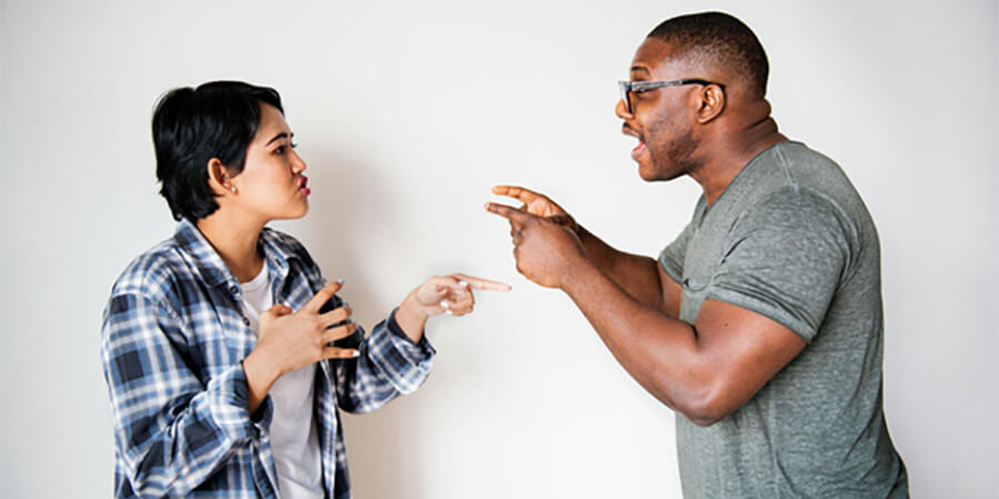 Two people engaged in a conflict.