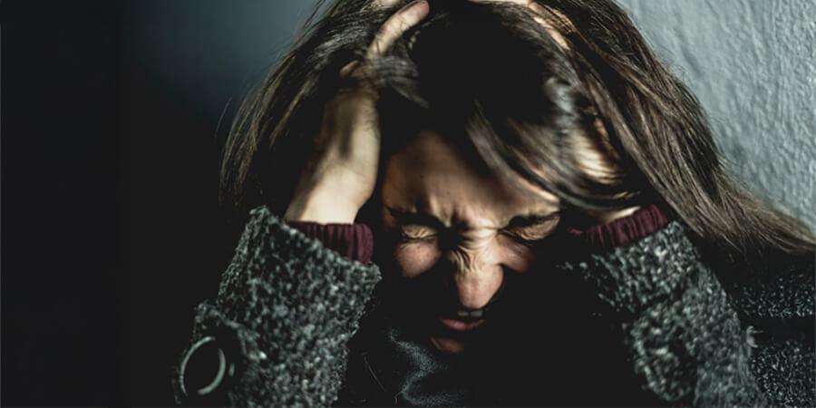 Woman suffering from emotional trauma.