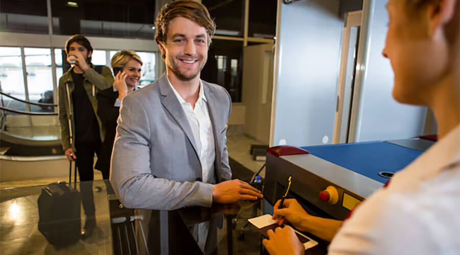 Happy male customer at airport.