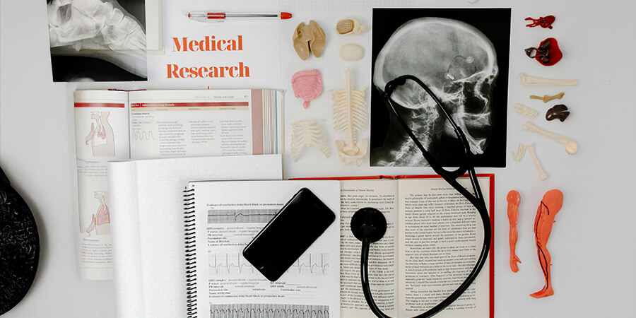 Many healthcare related items with the text, 'Medical Research'.