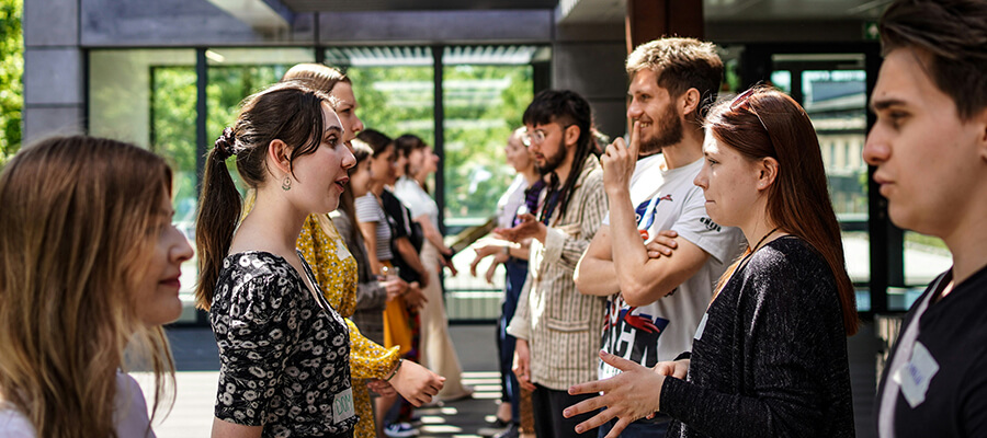 Group of people engaging in an ice-breaking activity.