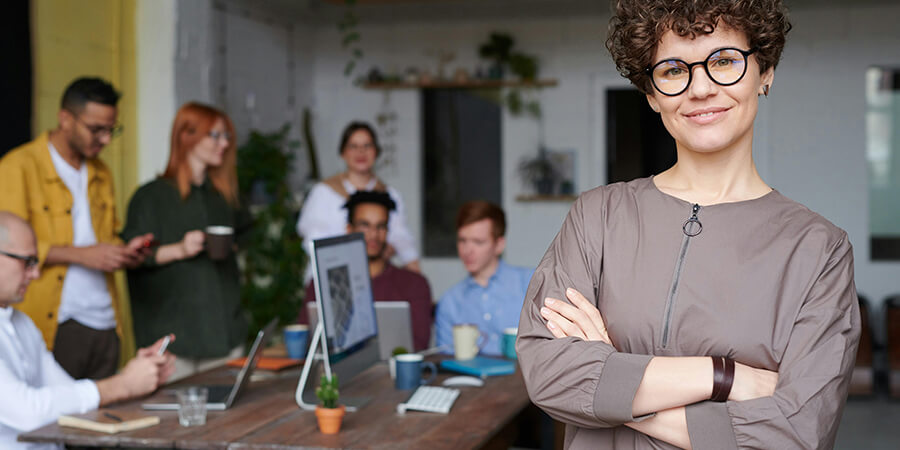 Leader standing in front of her team.