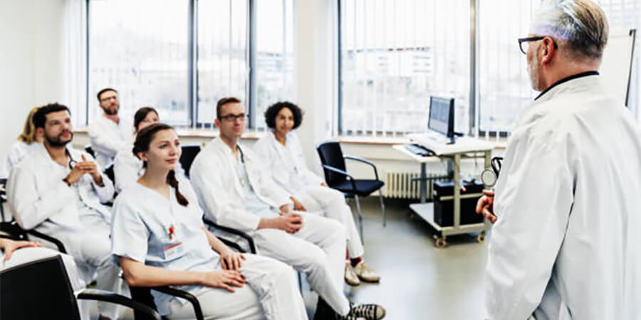 Medical professionals being trained in a classroom.