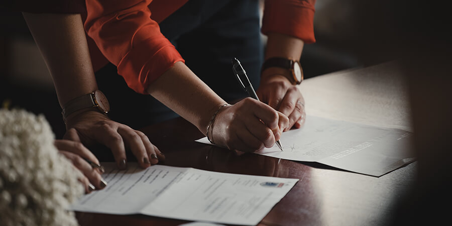 Signing legal papers.