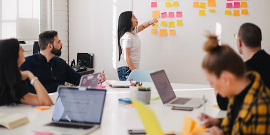 Working group of people with lots of post-it notes.
