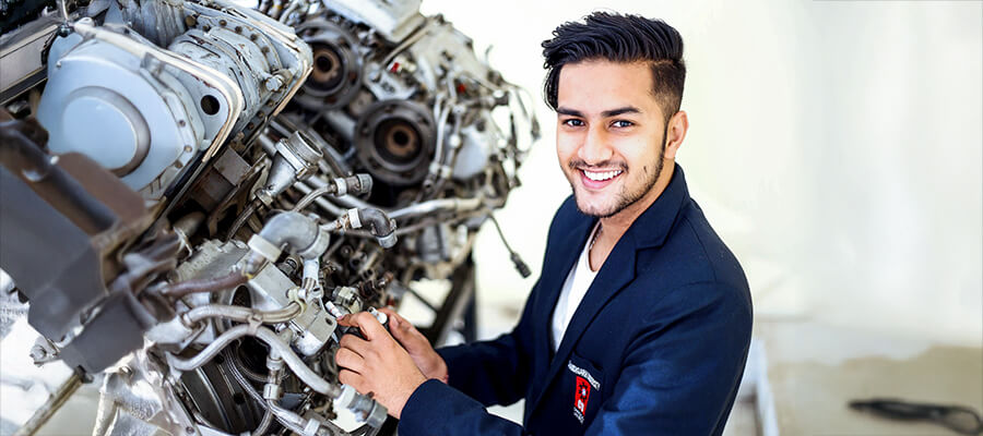 Mechanic working on a large engine.